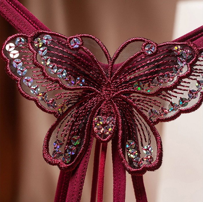 NA012 จีสตริงผีเสื้อร้อยมุกสุดเซ็กซี่ จีสตริงเปิดเป้าเป็นสายยางยืดด้านหน้าแต่งผีเสื้อช่วงล่างเปิดเป้ามีสายร้อยมุกผ่ากลางตามรูป