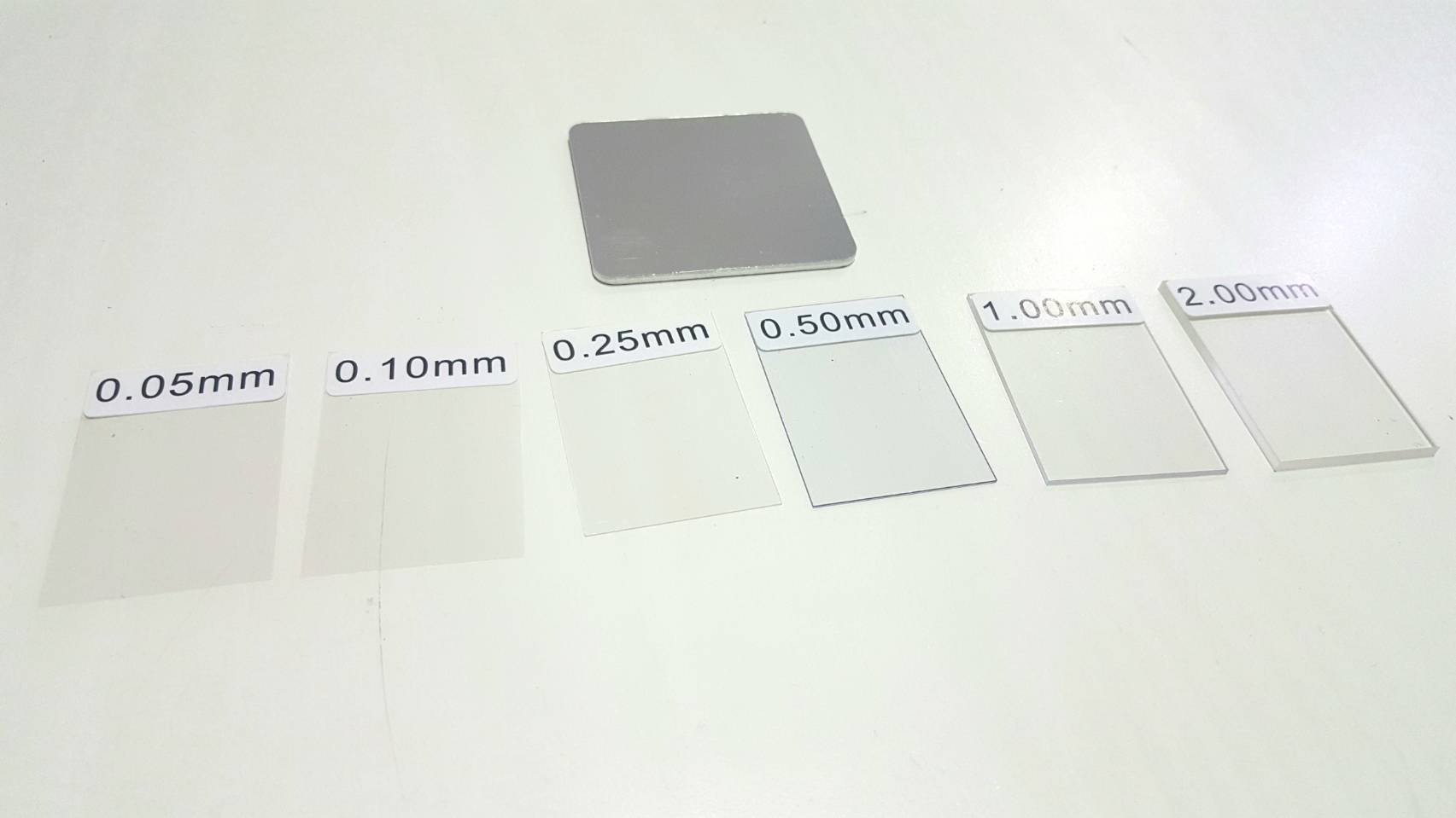 แผ่นฟิลม์สำหรับสอบเทียบเครื่องวัดความหนาสีแบบชุด NFE and Plastic Size mm Size : 0.05,0.10,0.25,0.50,1.00,2.00 mm