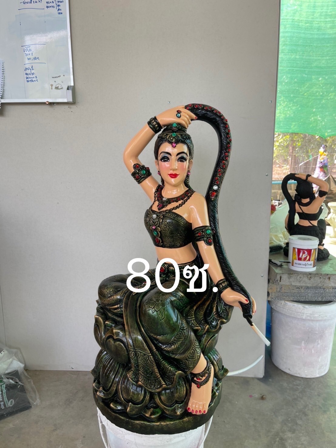 พระแม่ธรณีบีบมวยผม